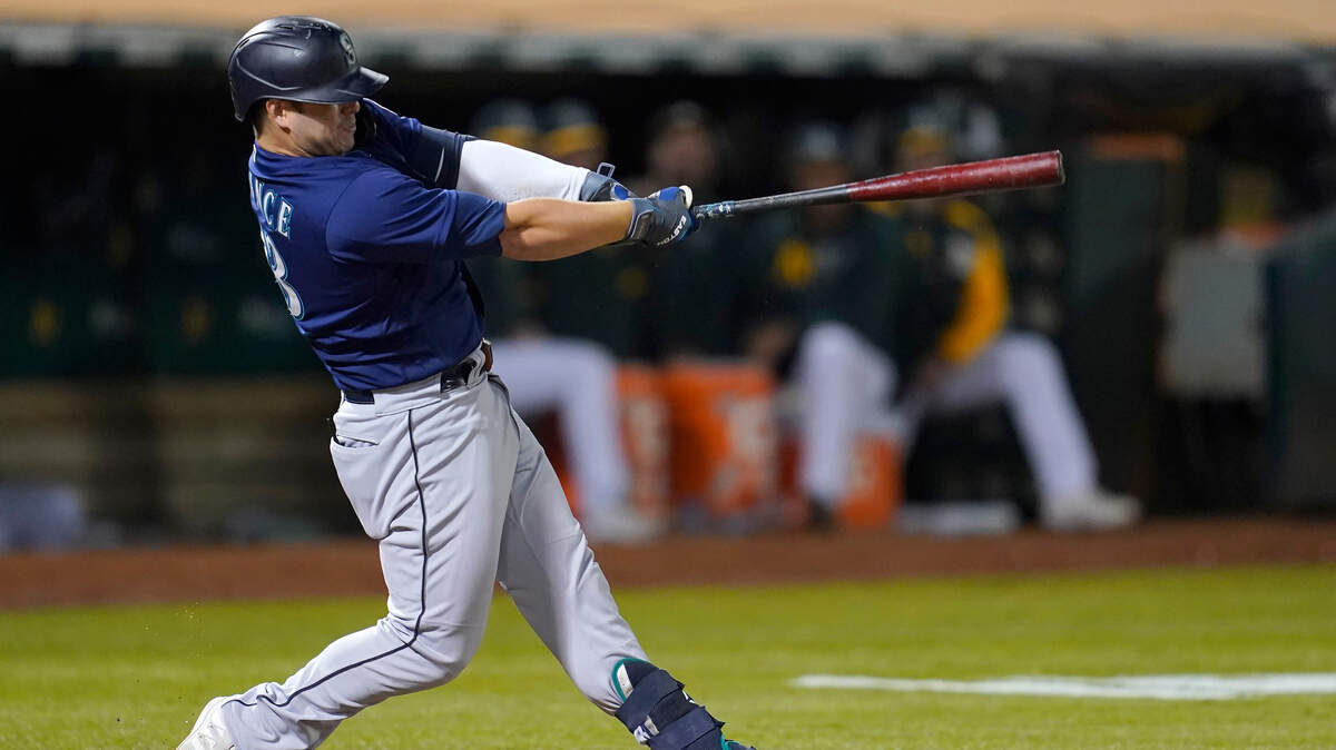 Seattle Mariners’ Ty France hits a home run against the Oakland Athletics during the ninth inning of a baseball game in Oakland, Calif., Monday, Aug. 23, 2021. (AP Photo/Jeff Chiu)