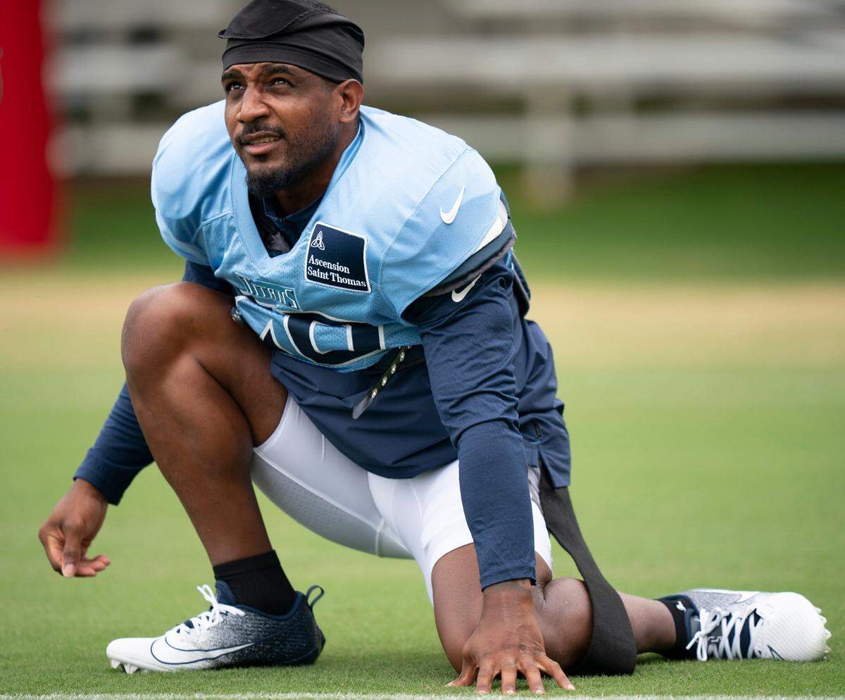 Tennessee Titans safety Quandre Diggs (26) stretches at Ascension Saint Thomas Sports Park in Nashville, Tenn., Wednesday, Aug. 14 2024. This is the first day of the Titans joint practice with the Seattle Seahawks.