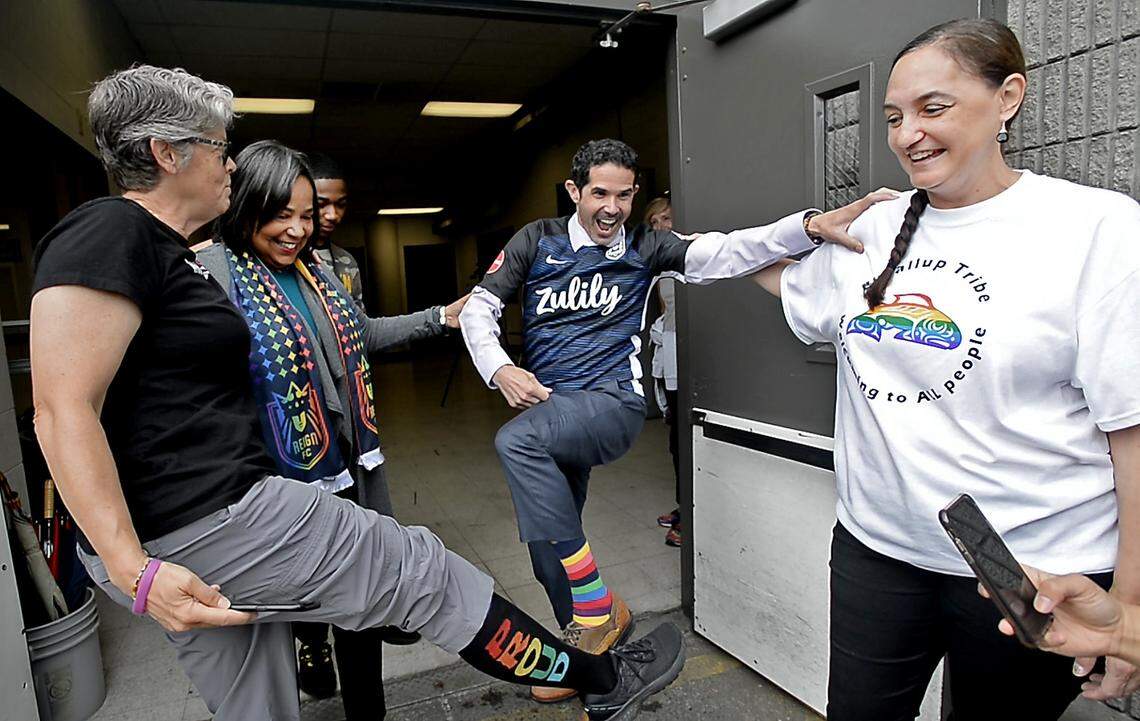 Puyallup Tribal Council member Annette Bryan, right, laughs as state Rep. Laurie Jinkins, left, Tacoma mayor Victoria Woodards and Tacoma City Council member Ryan Mello show off their rainbow-colored wardrobe prior to the first-ever raising of the iconic gay pride flag over the Tacoma Dome on Tuesday, July 9, 2019.