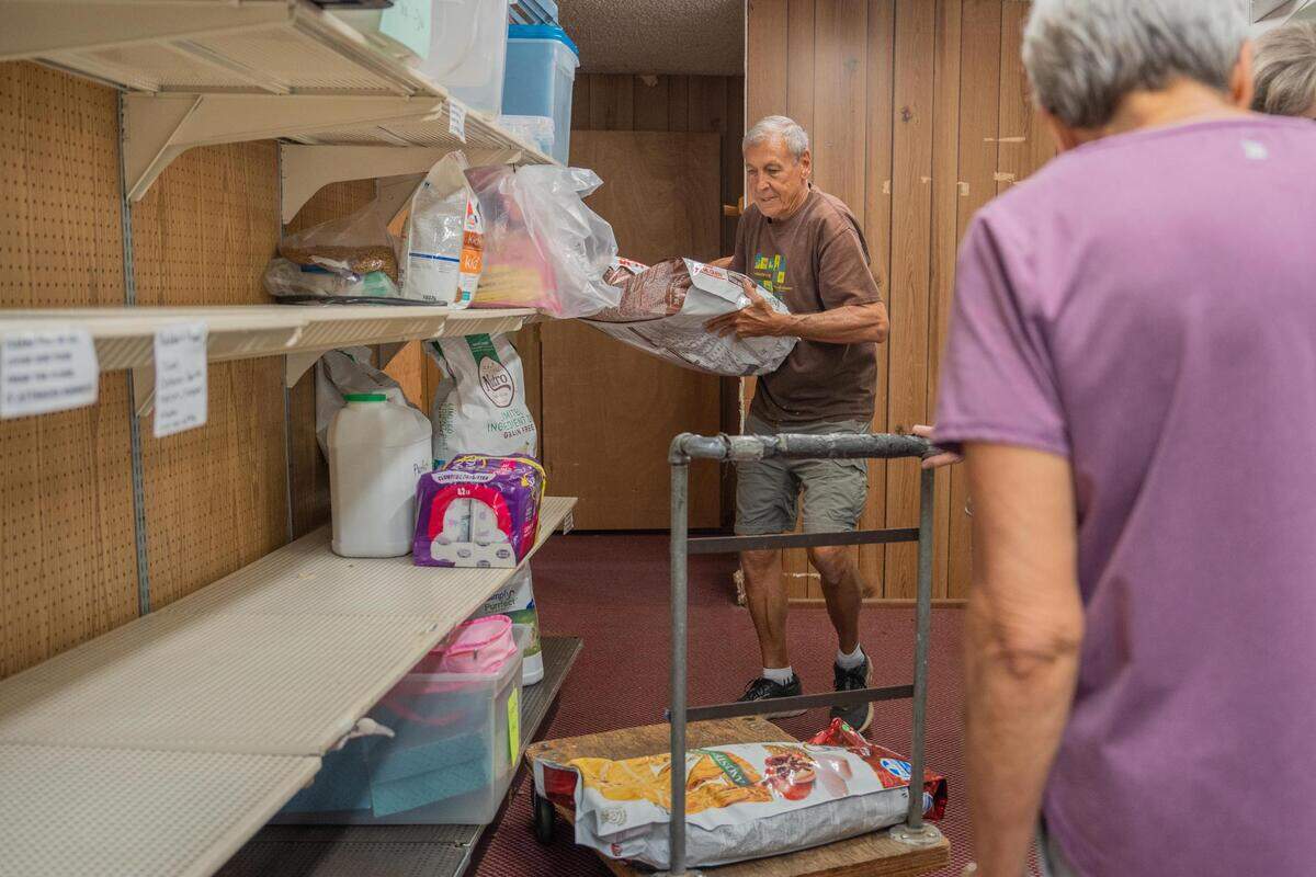 FISH Food Bank Volunteer Rich Peterson helps clear out the old building and into their new facility on Friday July 8, 2022. The new facility is set to officially open its doors Wednesday, July 13.