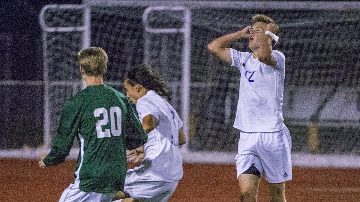 Kurtis Vanhout of Sumner High School knows that a great scoring opportunity was missed after goalie Lucas Richardson of Skyline recovered the ball while lying down in a boys 4A state semifinal soccer game at SparksStadium in Puyallup, May 25, 2018.  Skyline won 1-0 in two overtimes.