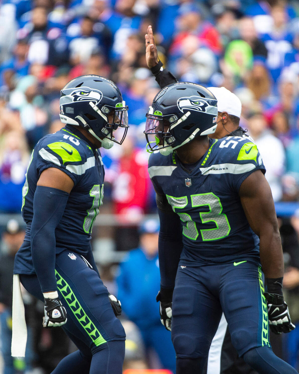 Seattle Seahawks linebacker Uchenna Nwosu (10) and Seattle Seahawks linebacker Boye Mafe (53) celebrate after sacking New York Giants quarterback Daniel Jones (8) in the second quarter of an NFL game at Lumen Field in Seattle, Wash. on Oct. 30, 2022. The Seahawks defeated the Giants 27-13.