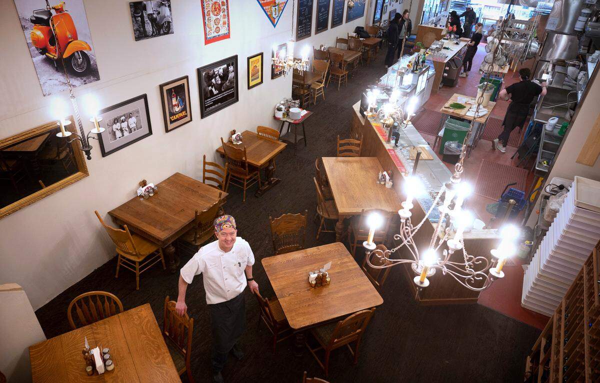 Marshall Jett and his team bake one-of-a-kind pies in a hand-built clay oven at APIZZA Little Italy in downtown Tacoma.