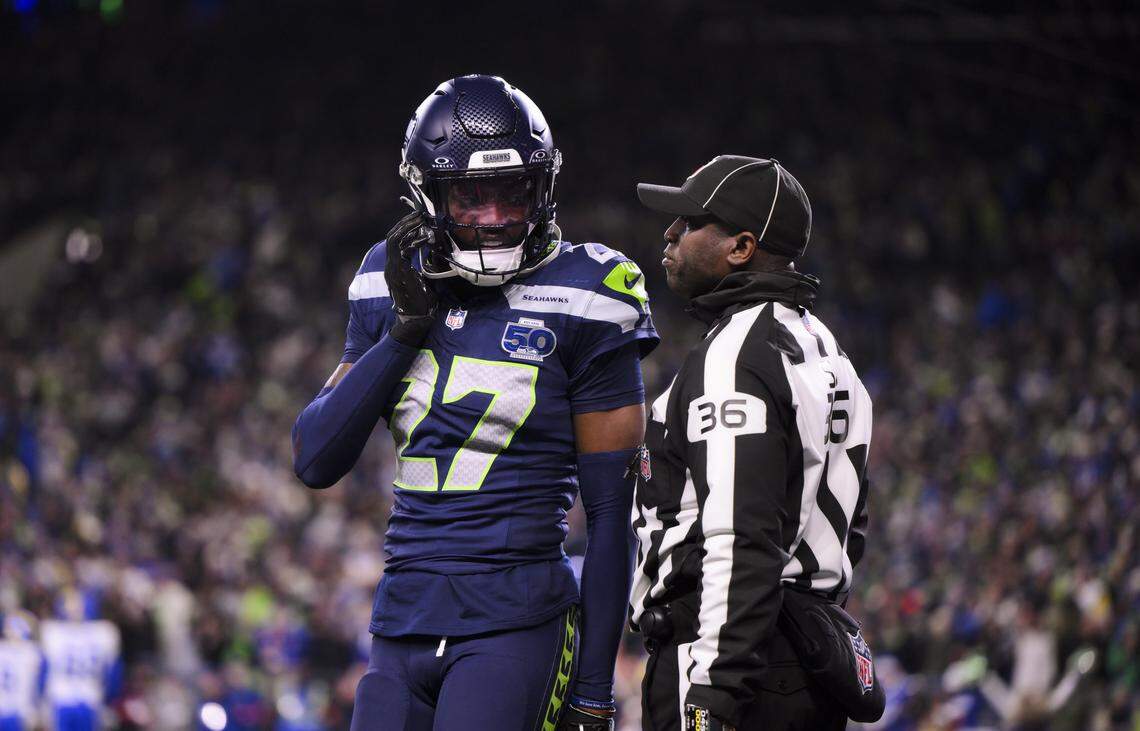 Seattle Seahawks cornerback Riq Woolen (27) comes off the field as a ref talks to him during the fourth quarter of the NFC Championship game against the Los Angeles Rams at Lumen Field, on Sunday, Jan. 25, 2026, in Seattle.