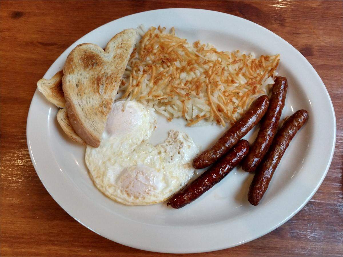 A two-egg breakfast with toast and sausage at West Pioneer Grill.