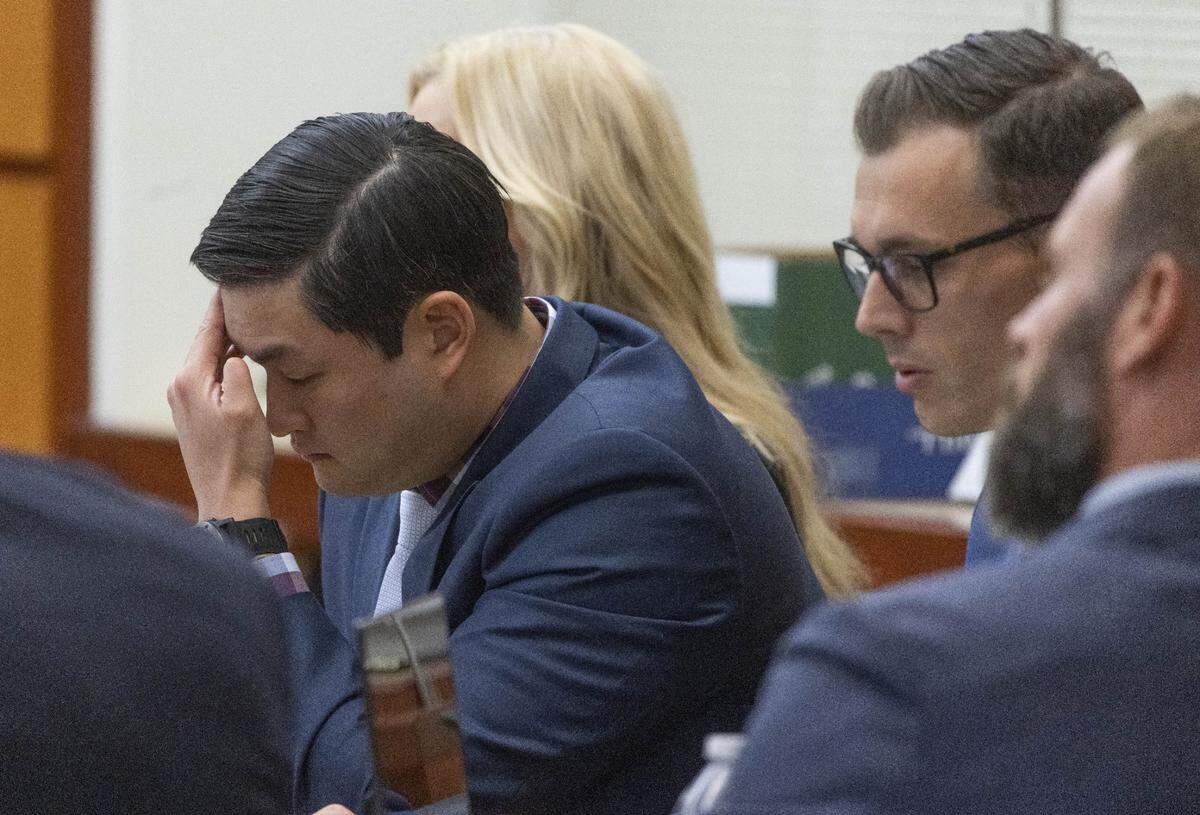 Tacoma Police Officer Timothy Rankine listens during the trial for the murder of Manny Ellis in Pierce County Superior Court Wednesday, October 18, 2023. Ellis was killed by three Tacoma police officers, including Rankine, during his arrest and the officers are now on trial for his murder Wednesday, October 4, 2023. Defense attorney Anne Bremner is right of Rankine and to her right is defense attorney Mark Conrad. At far right is another of the involved officers, Matthew Collins. (Ellen M. Banner / Pool / The Seattle Times)