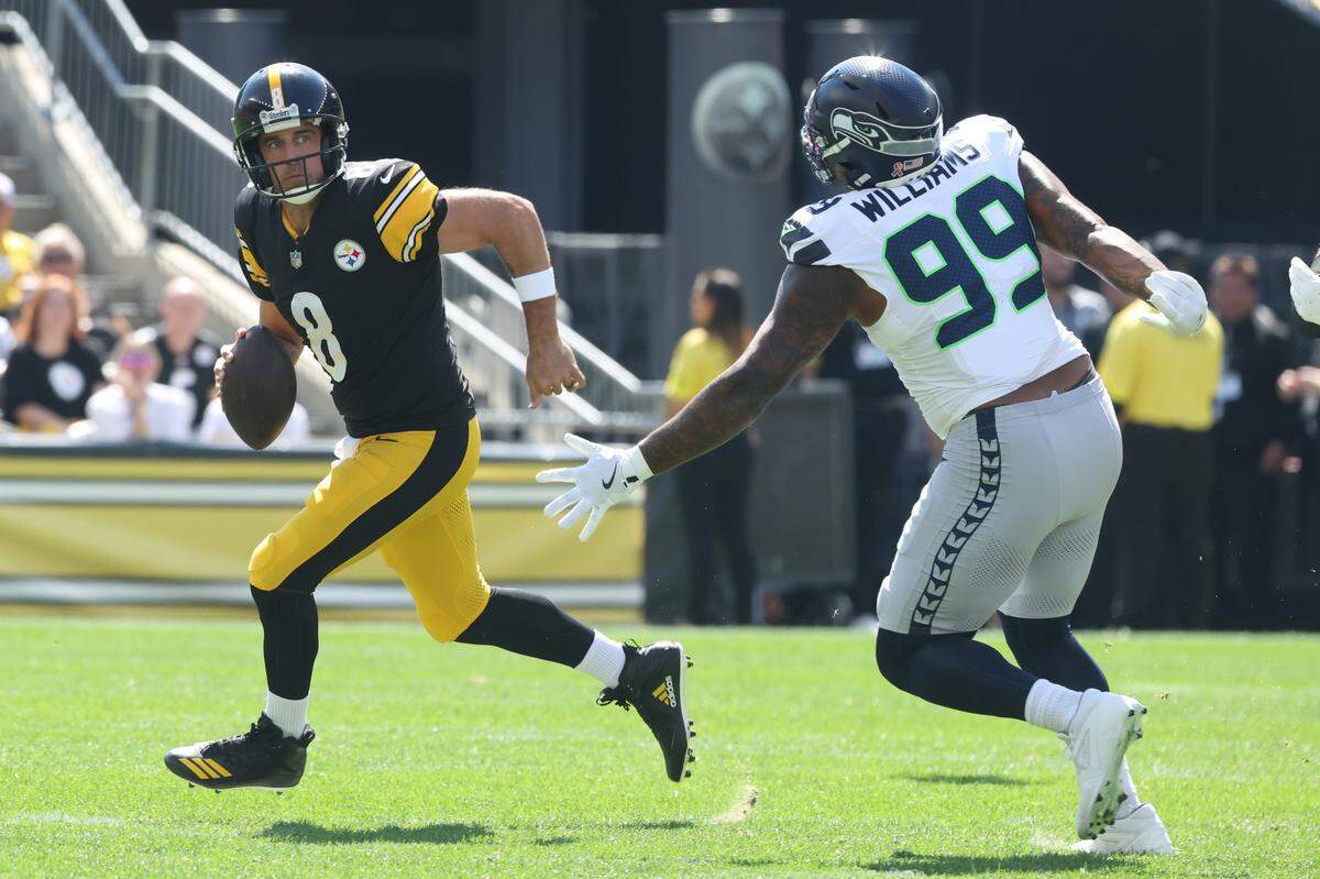 Sep 14, 2025; Pittsburgh, Pennsylvania, USA; Pittsburgh Steelers quarterback Aaron Rodgers (8) looks to pass against the Seattle Seahawks during the first quarter at Acrisure Stadium. Mandatory Credit: Charles LeClaire-Imagn Images