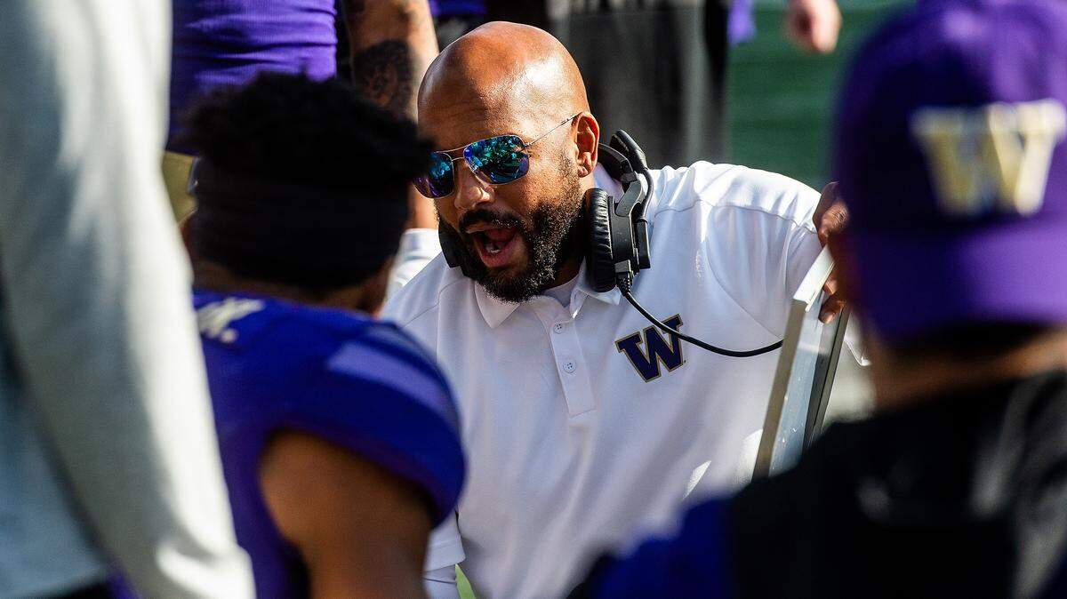 Jimmy Lake coaches up the defense during the fourth quarter. The Washington Huskies played the USC Trojans in a NCAA football game at Husky Stadium in Seattle, Wash., on Saturday, Sept. 28, 2019.
