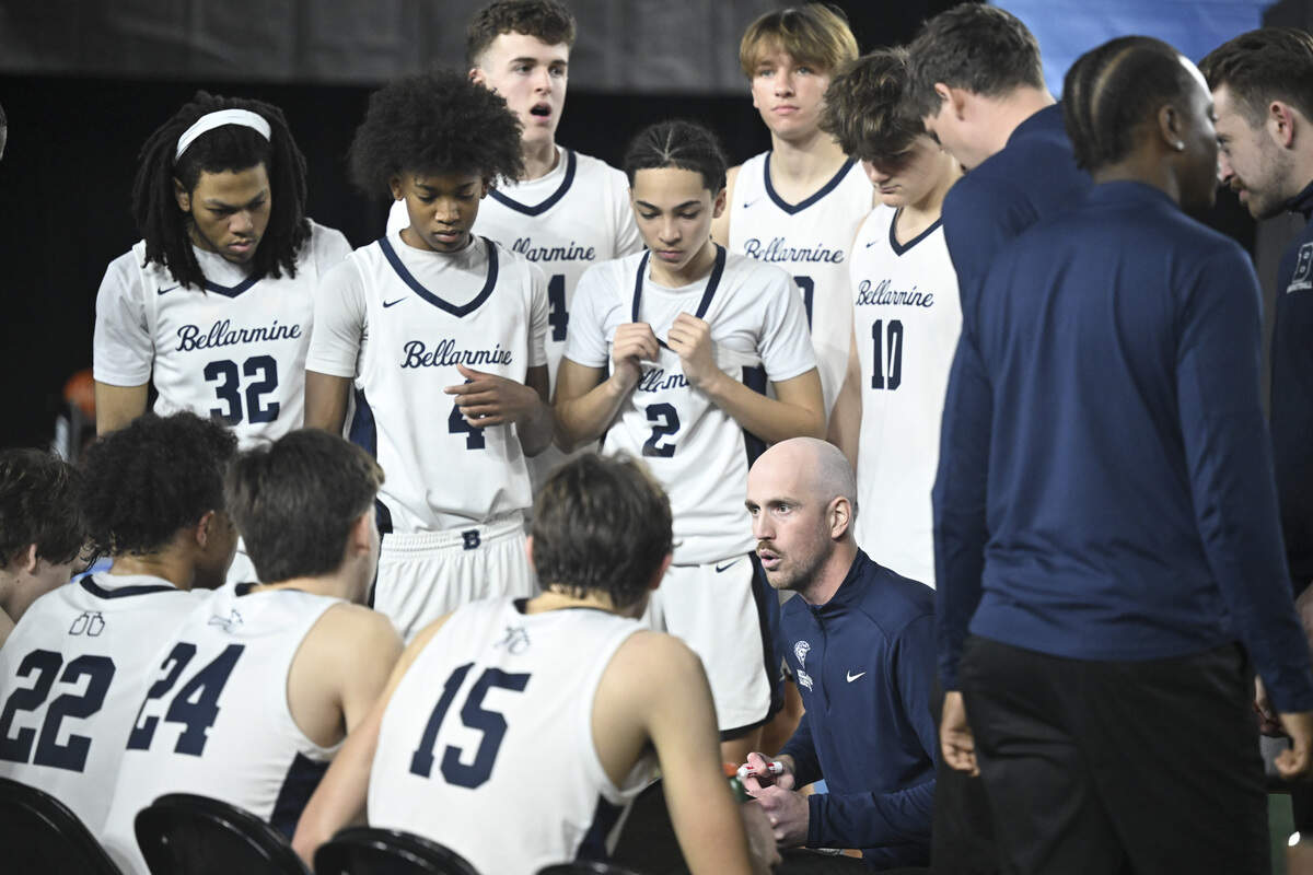 Bellarmine Prep head coach Bobby Moorehead huddles with players during a time out in the quarterfinal round of the 3A State Tournament against Edmonds-Woodway at the Tacoma Dome, on Thursday, March 5, 2026, in Tacoma, Wash.