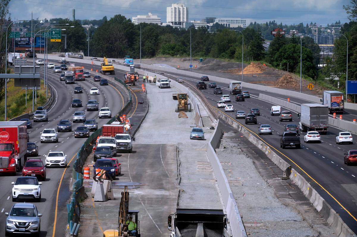 Traffic rolls north (left) and south past the new HOV lane work zone near the Port of Tacoma Road exit on Interstate 5 through Tacoma, Washington on Thursday, June 16, 2022.