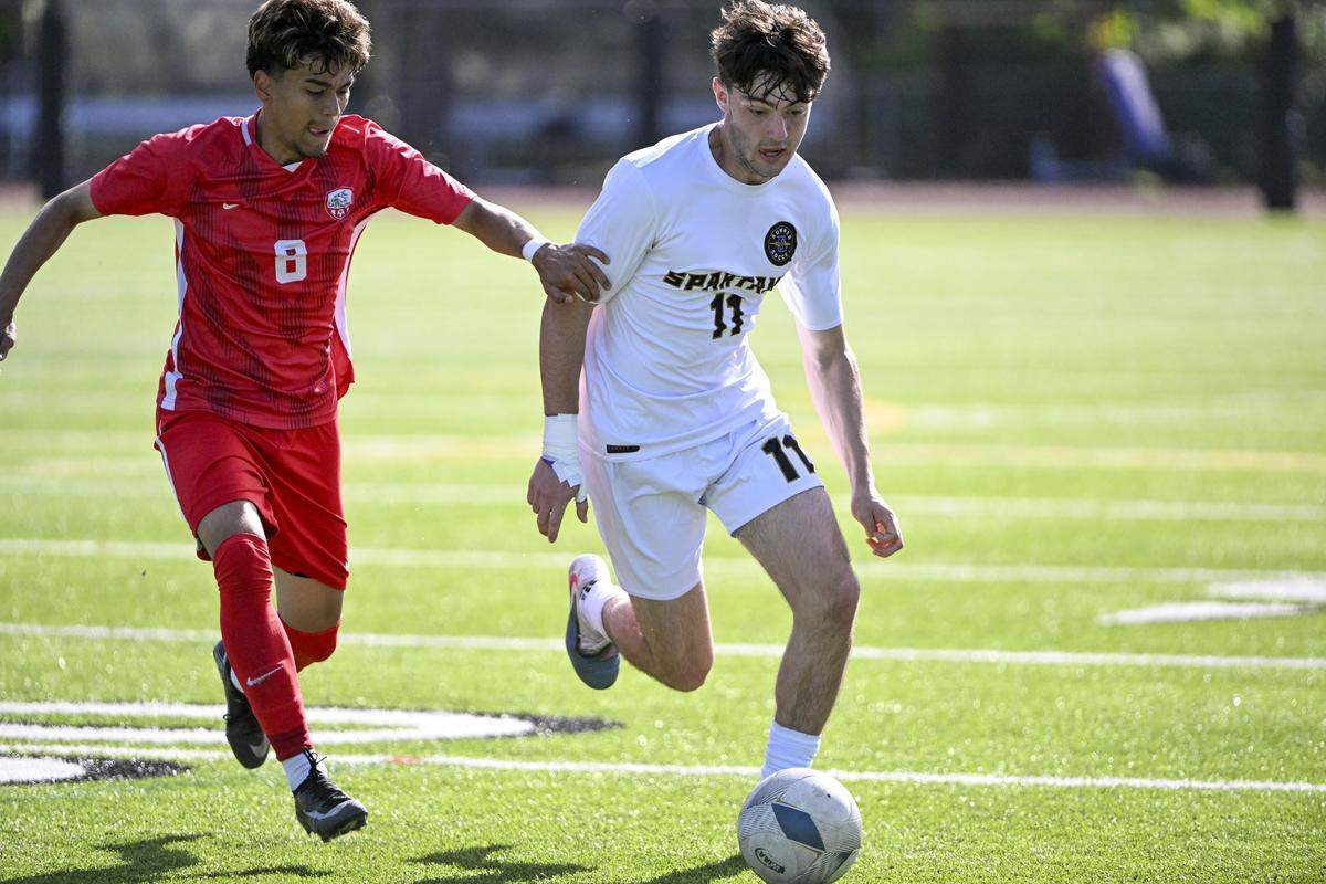 Eastmont’s Jaden Espinoza (8) chases after Sumner’s Gavin Murphy (11) on Saturday, May 30, 2026, during the 2026 4A Boys Soccer Championships final in Puyallup, Wash.