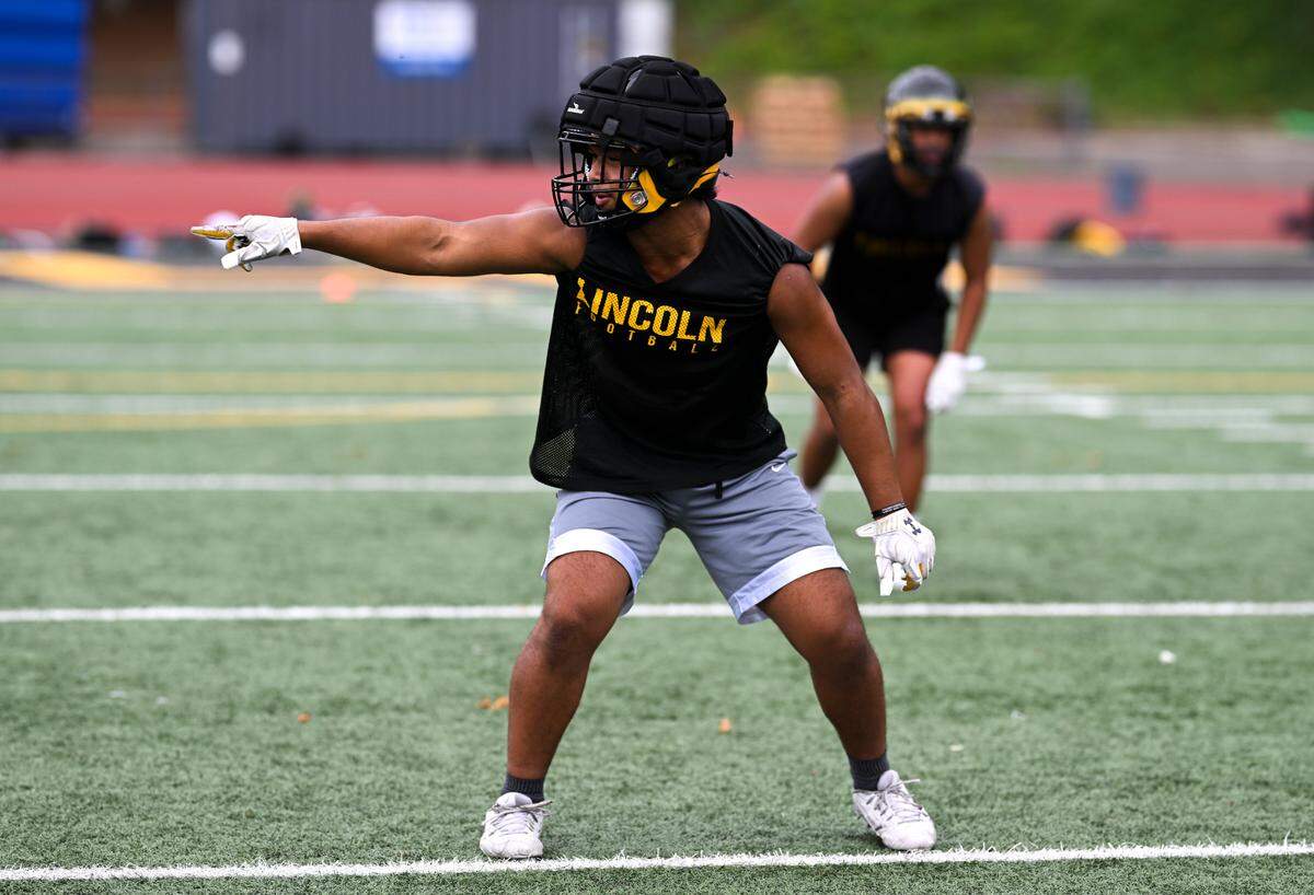 Lincoln linebacker Dre Sio Fetau runs drills during a football practice at Lincoln high School, on Wednesday, Aug. 21, 2024, in Tacoma, Wash.