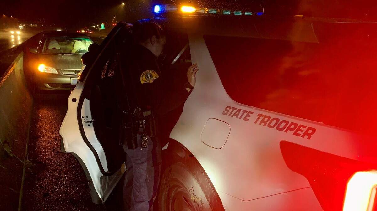 A Honda Civic is parked facing the wrong direction on Interstate 5 in DuPont early Sunday morning after a state trooper stopped the allegedly impaired driver.