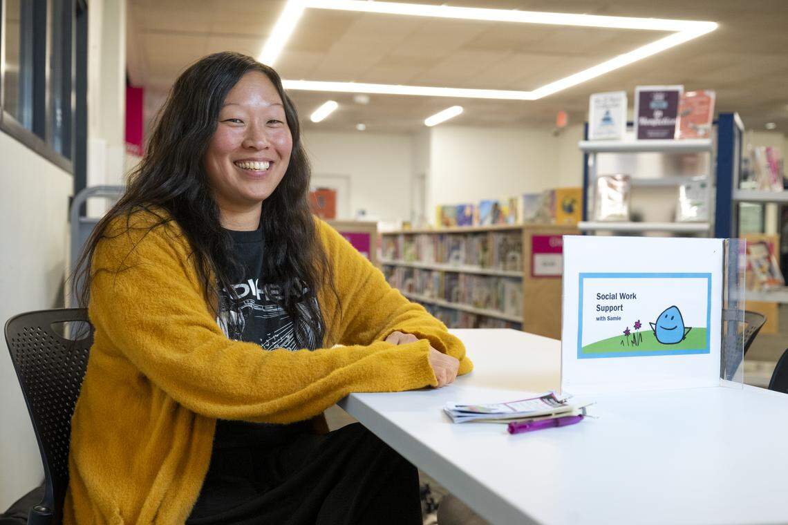 Samie Iverson, the library social worker for Tacoma Public Library, poses for a portrait on Friday, Dec. 5, 2025, at the Main Branch in Tacoma, Wash. Iverson offers social work support from tables set up regularly at Tacoma library branches.