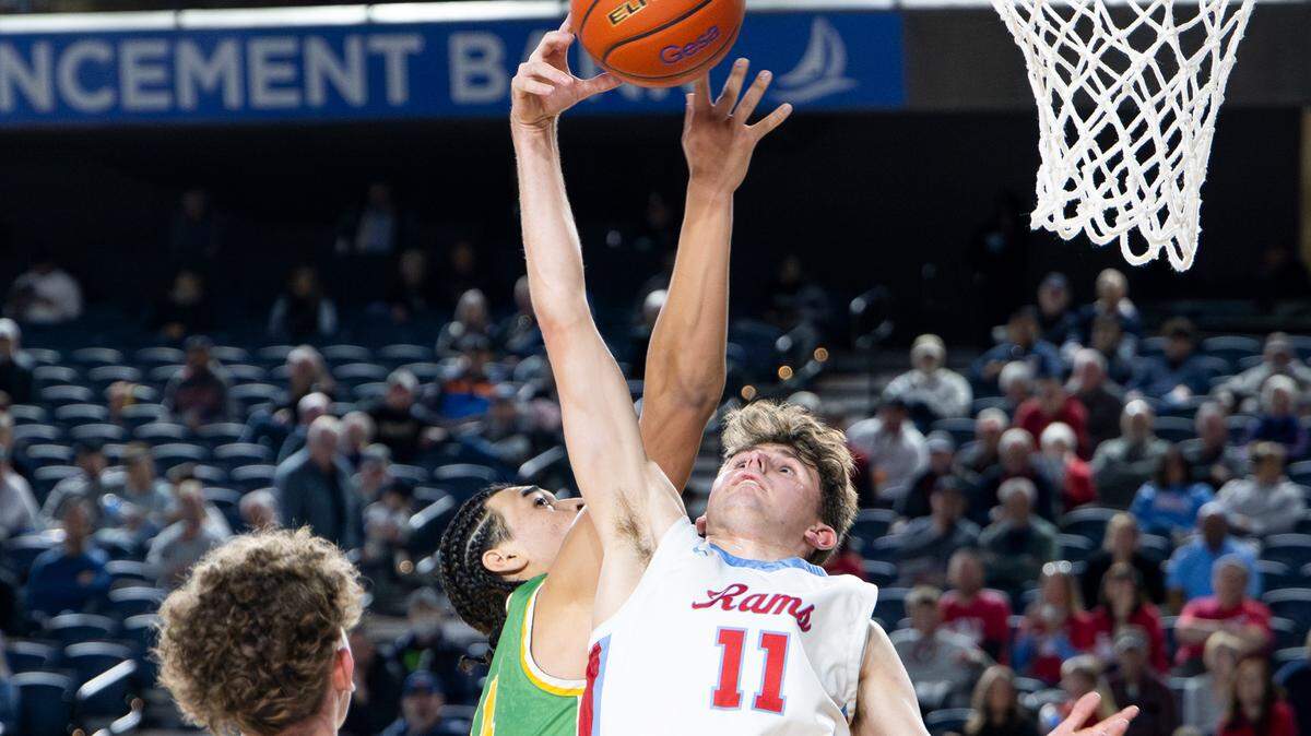 Richland’s Sylen Kiesel-Kauhane (14) and West Valley’s Landen Birley (11) fight for a rebound during the first half of a Class 4A state basketball tournament quarterfinal game at the Tacoma Dome on Thursday, March 6, 2025, in Tacoma, Wash.