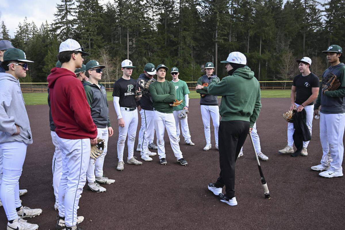 Peninsula huddles up during practice on Monday, March 9, 2026, in Gig Harbor, Wash.