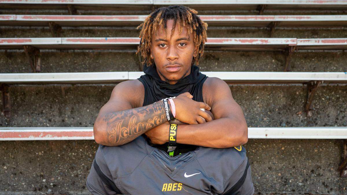 Lincoln senior QB Gabarri Johnson poses for a portrait on Wednesday, Aug. 17, 2022, at Lincoln High School in Tacoma, Wash.