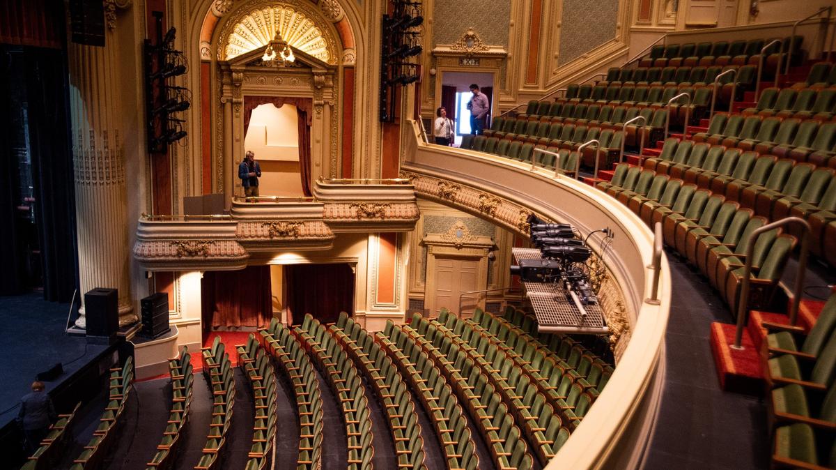 Media members take photos and walk along the balcony during a media tour at the Pantages Theater in Tacoma on Nov. 12, 2018.