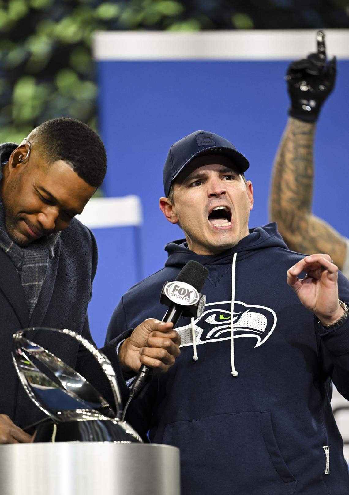 Seattle Seahawks head coach Mike MacDonald accepts the George Halas Trophy for winning the NFC Championship against the Los Angeles Rams at Lumen Field, on Sunday, Jan. 25, 2026, in Seattle.