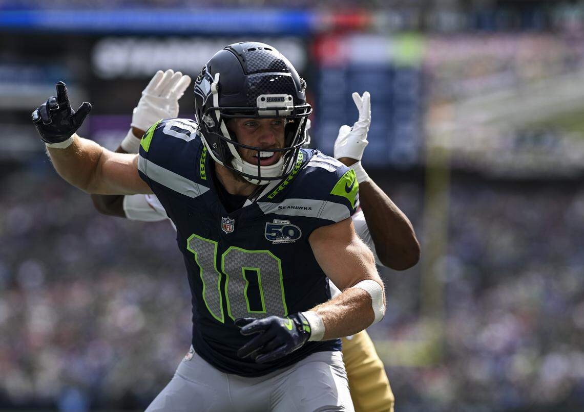 Seattle Seahawks wide receiver Cooper Kupp (10) reacts to a pass interference from San Francisco 49ers cornerback Deommodore Lenoir (2) that put the Seattle Seahawks in scoring position during the second quarter of the game at Lumen Field, on Sunday, Sept. 7, 2025, in Seattle.