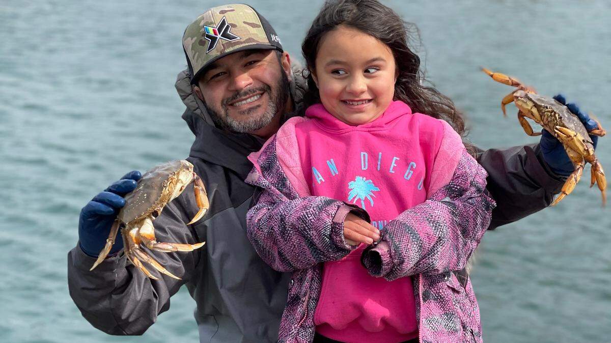 Crab fisherman David Sandana and his daughter with catch. Crab season will open July 11 in waters adjacent to Gig Harbor