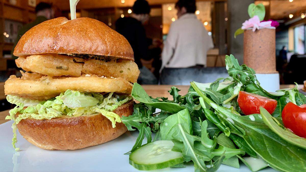 Chef Mike Parker presses tofu for two days to create this “fishless” sandwich for Honey at Alma Mater’s new lunch menu.