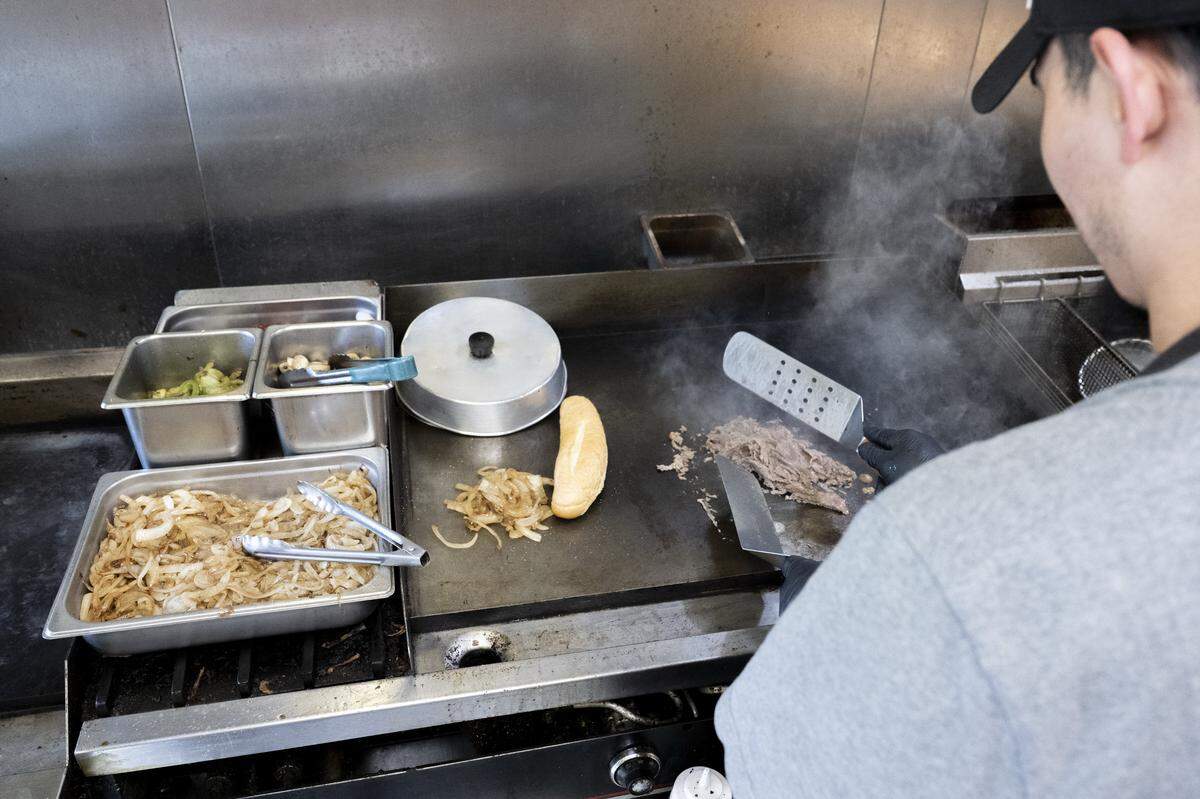 A cheesesteak is prepared in the kitchen of Philly-N-Smash on Monday, Sept. 22, 2025, in Fife, Wash.