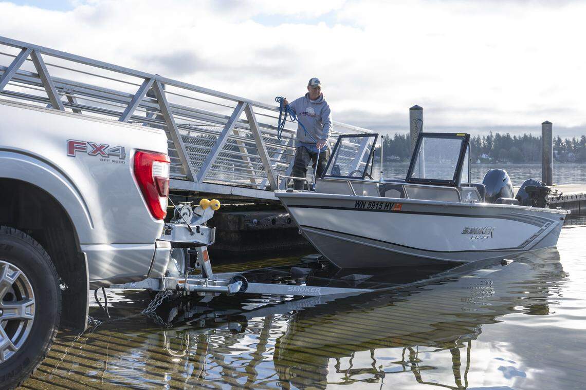 Eric Molver, of Puyallup, retrieves his boat using the American Lake boat launch on Tuesday, Jan. 13, 2026, at American Lake Park in Lakewood, Wash. The launch reopened this month after being closed for more than a year.