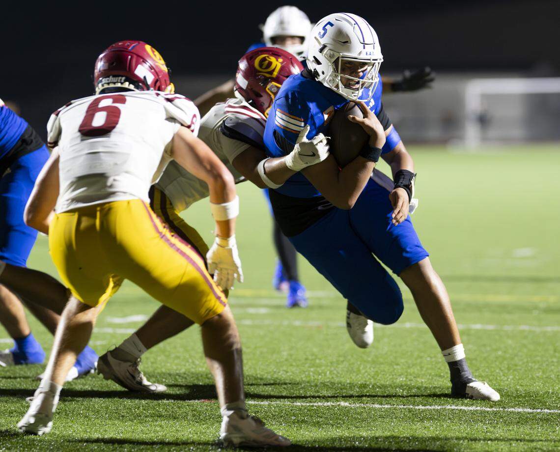 Graham-Kapowsin Eagles quarterback AJ Tuivaiave (5) punches in the touchdown to take the lead from O’Dea during the second half of the game at Art Crate Field, on Friday, Sept. 5, 2025, in Spanaway, Wash.