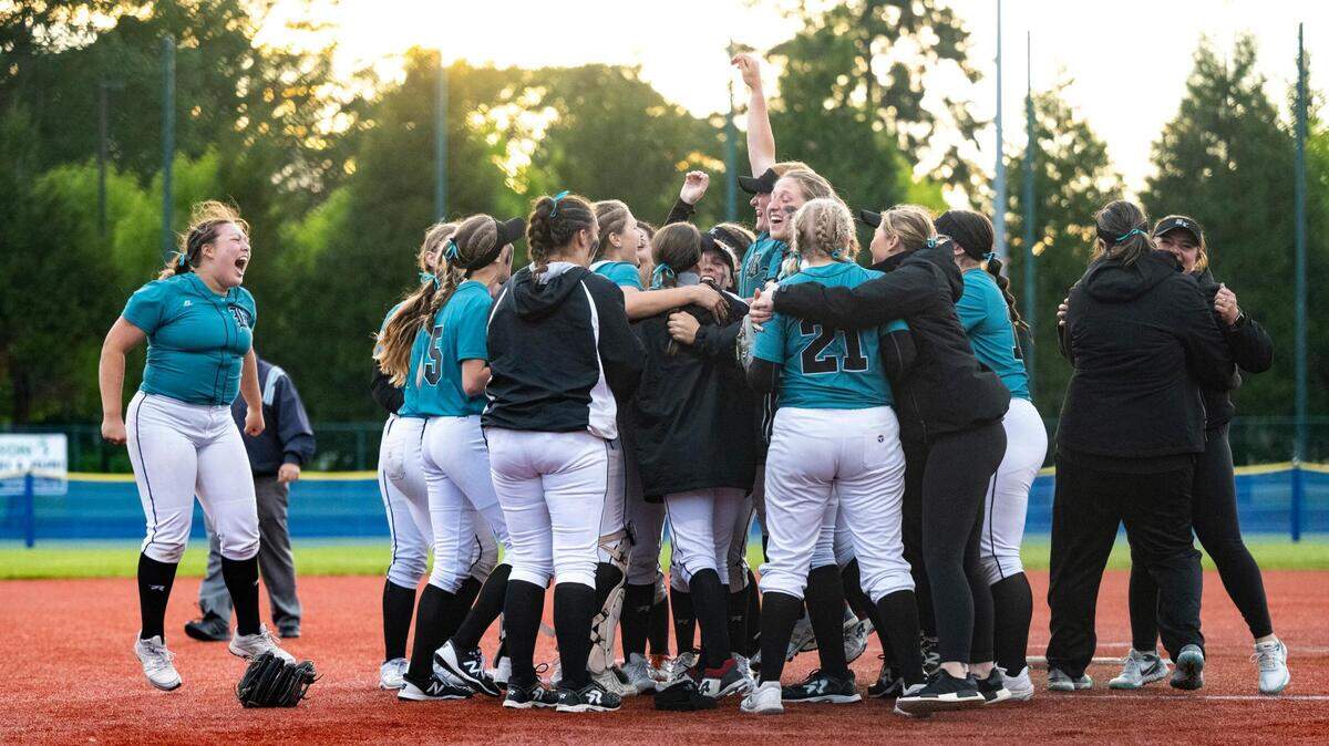 The Bonney Lake varsity softball team celebrates on the field after winning the 3A state softball tournament quarterfinals game at the Regional Athletic Complex on Friday, May 27, 2022 in Olympia, Wash. Bonney Lake defeated Peninsula 3-2 with a triple play in the seventh inning to win the quarterfinal game.