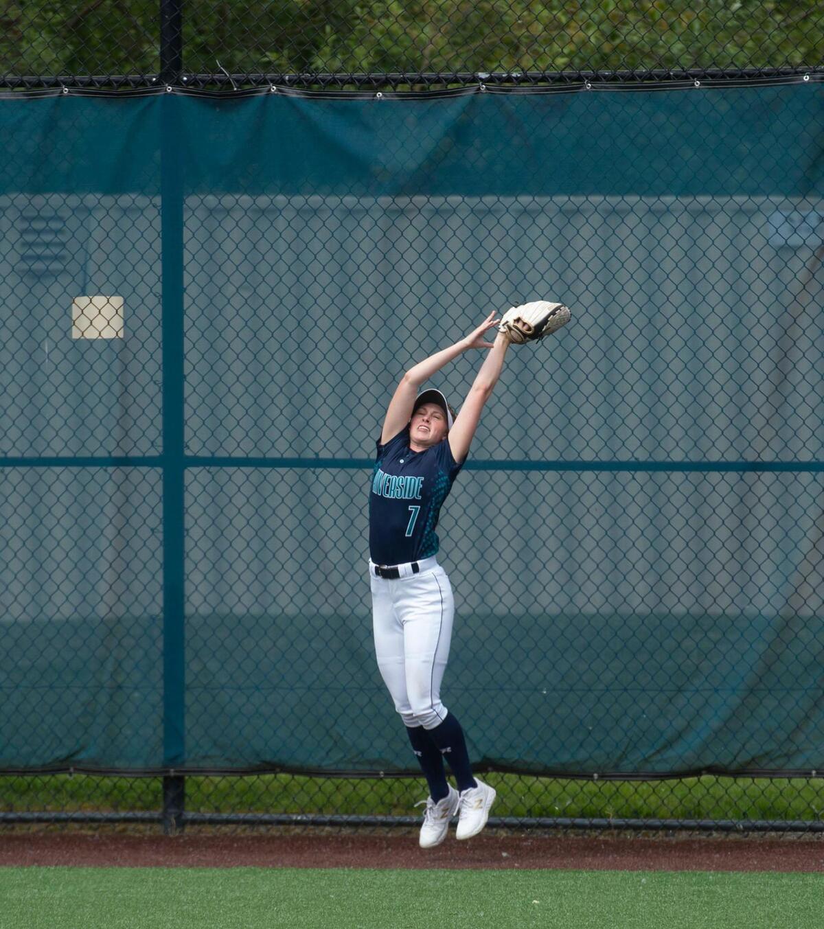 The Ravens’ Kaitlyn Anardi makes key catch near the fence during the NPSL softball championship game between Tahoma and Auburn Riverside on Saturday, May 22 at Auburn Riverside High School.