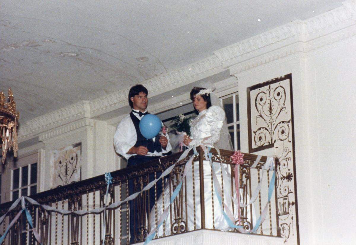 Lysandra Ness throws her wedding bouquet from the balcony of the Winthrop’s Crystal Ballroom on July 13, 1991.