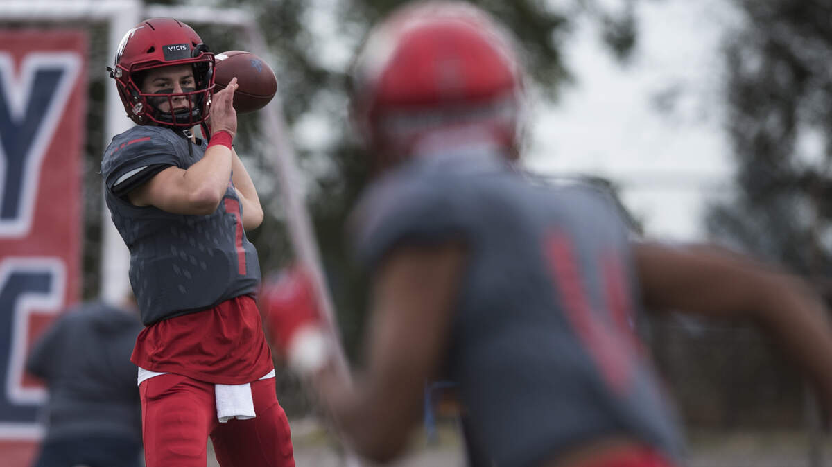 Kennedy Catholic High School quarterback Sam Huard warms up before a game. The Lancers played Enumclaw on Saturday, Sept. 29, 2018 at Highline Memorial Stadium in Burien.