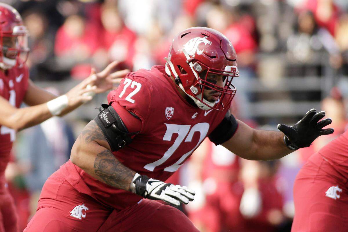 Washington State offensive lineman Abraham Lucas prepares to block during the second half of an NCAA college football game against BYU, Saturday, Oct. 23, 2021, in Pullman, Wash. (AP Photo/Young Kwak)