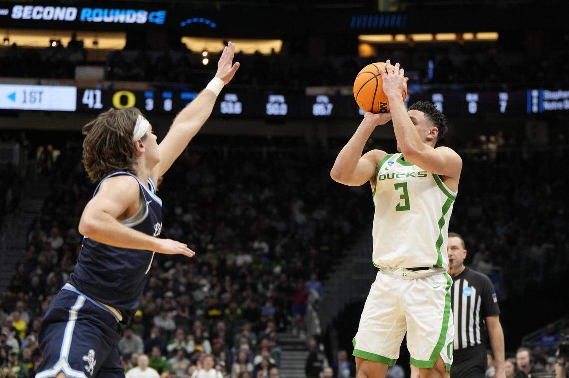 Mar 21, 2025; Seattle, WA, USA; Oregon Ducks guard Jackson Shelstad (3) shoots the ball over Liberty Flames guard Colin Porter (0) during the first half in the first round of the NCAA Tournament  at Climate Pledge Arena. Mandatory Credit: Stephen Brashear-Imagn Images