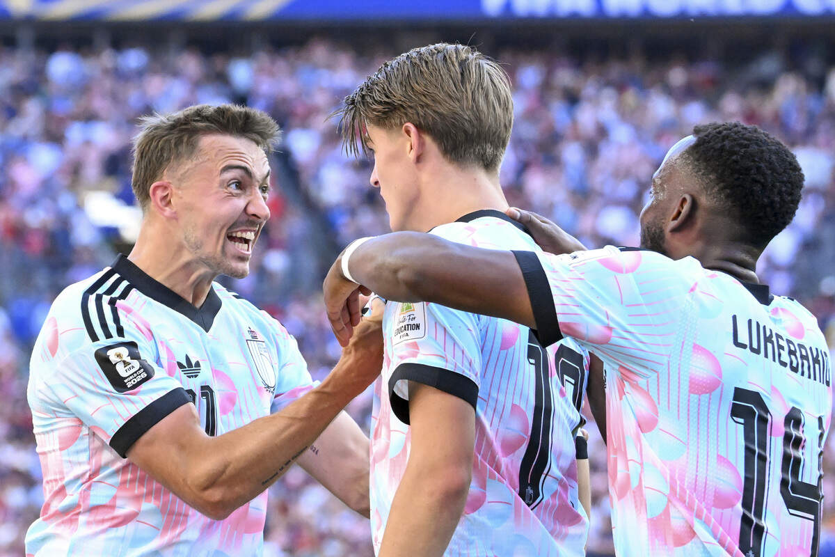 Belgium defender Timothy Castagne (21) celebrates Belgium forward Charles de Ketelaere (17) for his goal against the United States of America during a round of sixteen FIFA World Cup match on Monday, July 6, 2026, in Seattle.