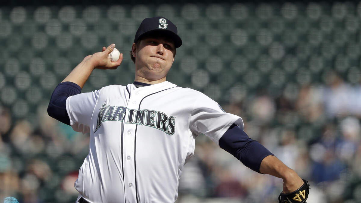 Seattle Mariners starting pitcher Erik Swanson throws to a Cleveland Indians batter during the first inning of a baseball game Wednesday, April 17, 2019, in Seattle. (AP Photo/Elaine Thompson)