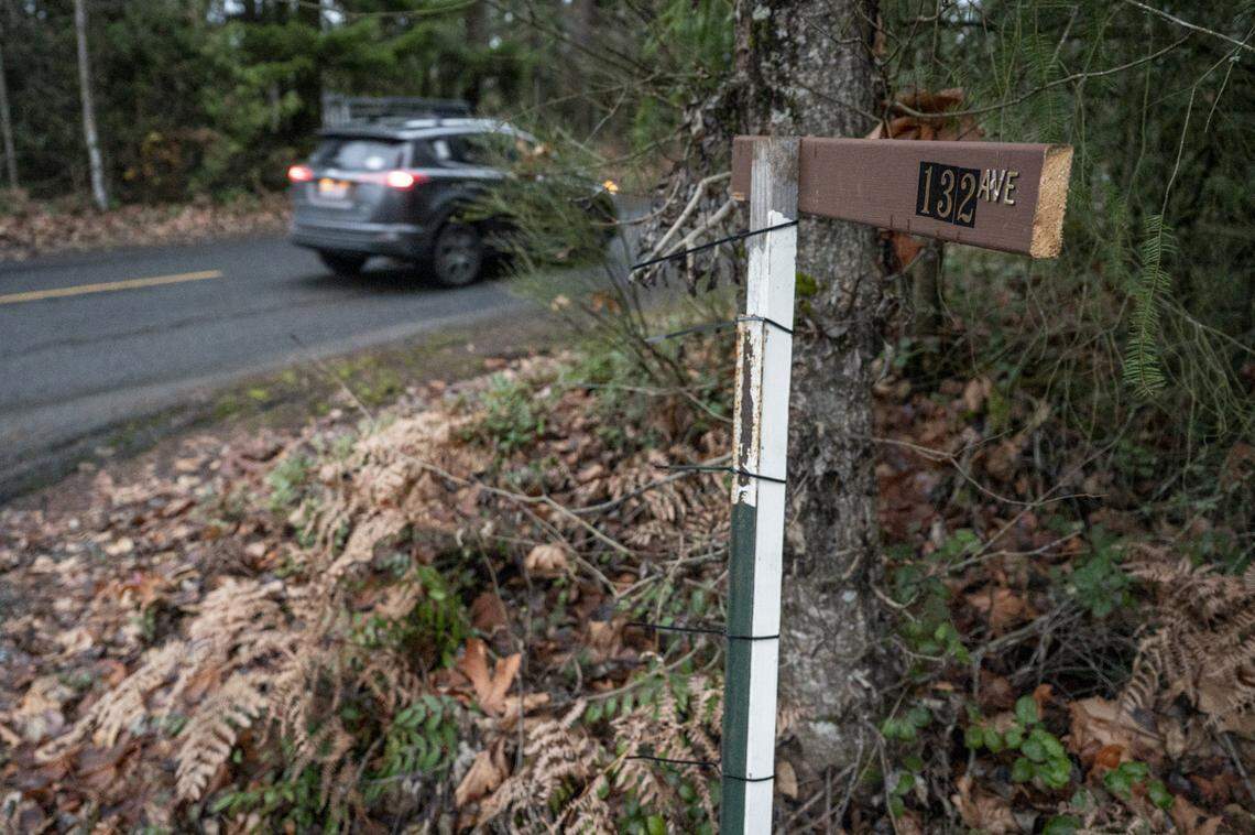A car moves along 288th Street East past the intersection of 132nd Avenue East on Tuesday, Dec. 2, 2025, in Graham, Wash. There was no stop sign there that day, but Google Maps shows one present in July 2024.