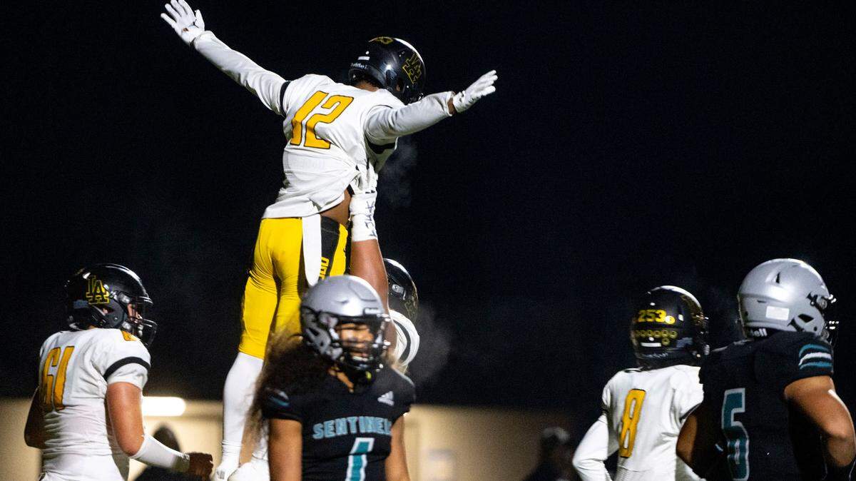 Lincoln receiver DJ Ervin is lifted up by a teammate after catching his second touchdown of the second quarter of a 3A PCL game against Spanaway Lake on Friday, Oct. 28, 2022, at Art Crate Field in Spanaway, Wash.
