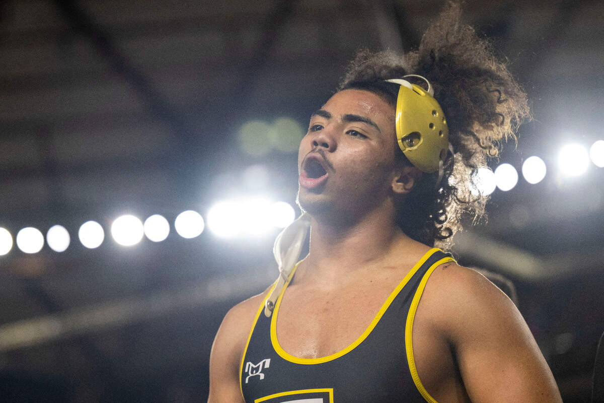 Lincoln’s Navarre Dixon celebrates after pinning Stanwood’s Mason Ferguson in a 182-pound, Class 3A semifinal match at Mat Classic XXXIV on Saturday, Feb. 18, 2023, at the Tacoma Dome in Tacoma, Wash.
