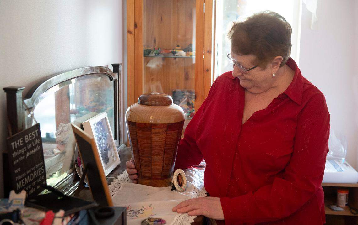 Rosella Berreman, the mother of Shawna Berreman - the first person in Pierce County to be confirmed with COVID-19 - stands with her daughterÕs urn at her home in Puyallup on Wednesday, Dec. 23, 2020.