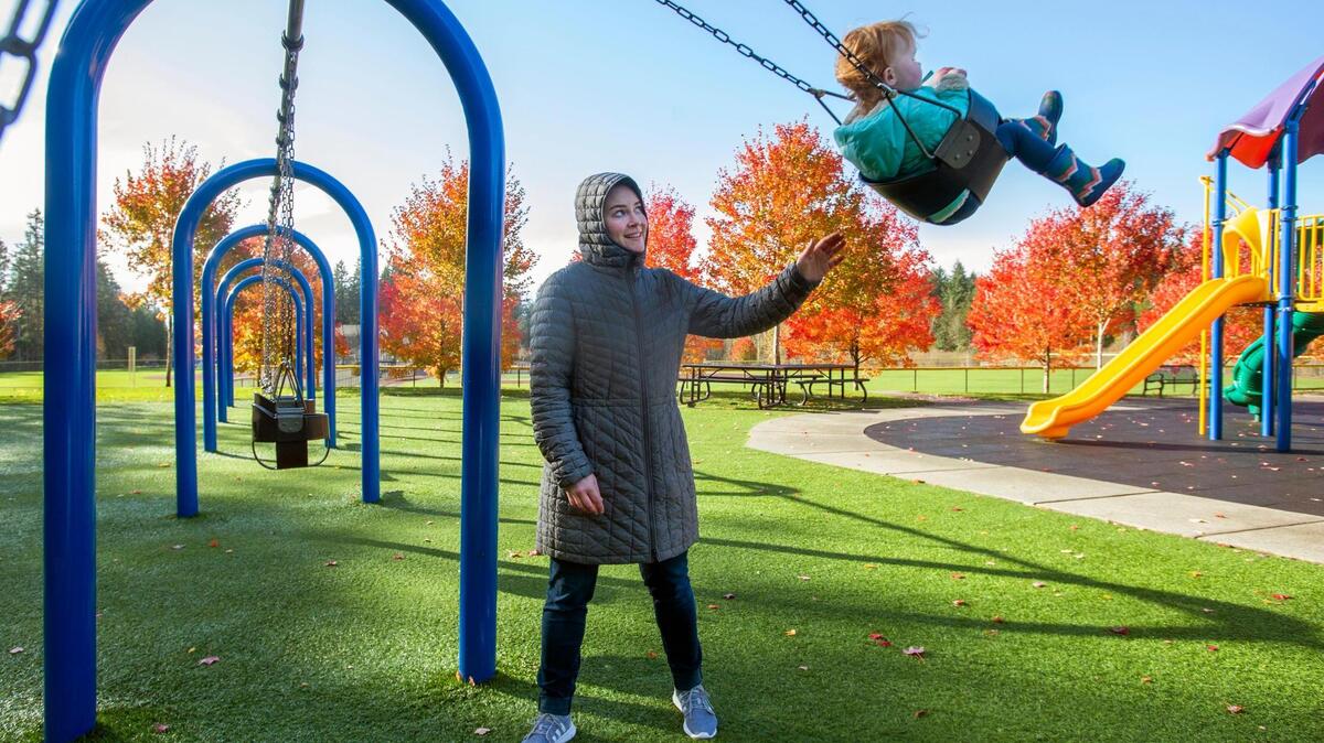 Some unexpected sunshine and lovely fall color provided enough incentive for Jacklyn Parrish to take her Della to Homestead Park in Gig Harbor on a blustery Friday, Nov. 13, 2020. The two-year-old lobbied heavily for a ride on the swings, “her favorite” playground activity.