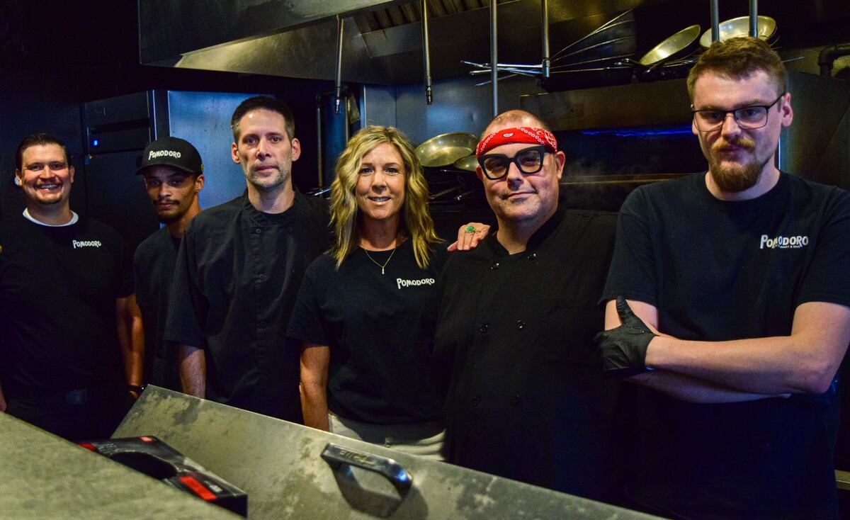 Behnke (center) with her kitchen staff last Saturday, from left to right: John, Deandre, Matt, Joe and Connor. They all started as dishwashers, she said. “We would take personality over experience any day.”