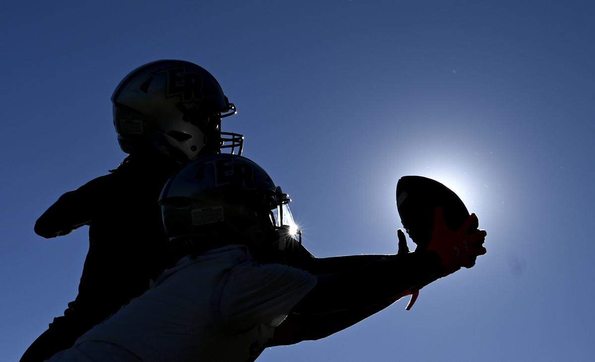 Wide receivers run drills during a football practice at Emerald Ridge High School, Wednesday, Aug. 16, 2023, in Puyallup, Wash.