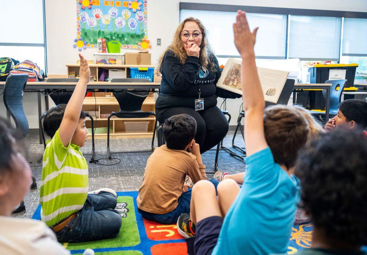 Puyallup Digital Learning teacher Angela Arteaga reads “The Tale of Peter Rabbit” to her kindergarten and first-grade students in her classroom at the Kessler Center in Puyallup. on May 18, 2023.