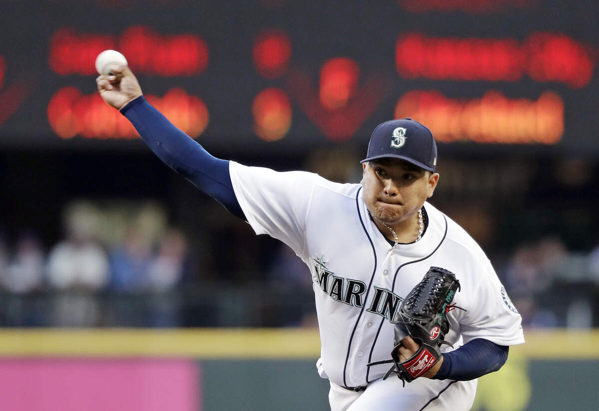 Seattle Mariners starting pitcher Erasmo Ramirez throws against the Baltimore Orioles in the second inning of a baseball game Monday, Sept. 3, 2018, in Seattle. (AP Photo/Elaine Thompson)