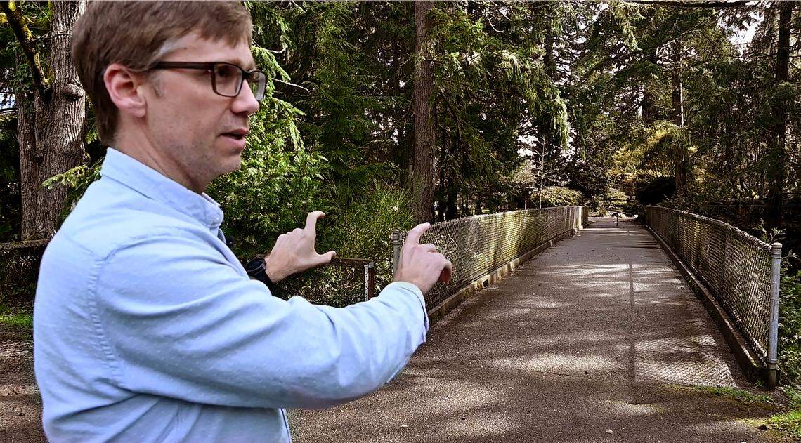 Parks Tacoma capital improvement program manager Terry Jungman explains the upcoming paved pathway project in Point Defiance Park During a March 27, 2025 tour. The second phase for the Loop Trail will connect from Wilson Way Bridge to numerous main public areas in the park while improving pedestrian safety.