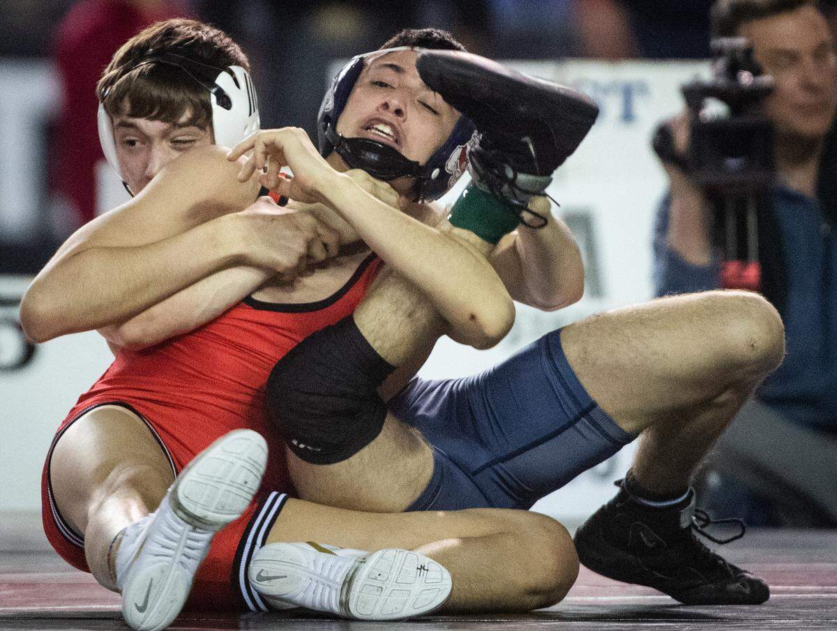 Granger’s Abel Nava grapples with Mitchell Helgert during day two of Mat Classic XXXII at the Tacoma Dome in Tacoma, Wash., on Saturday, Feb. 22, 2020.