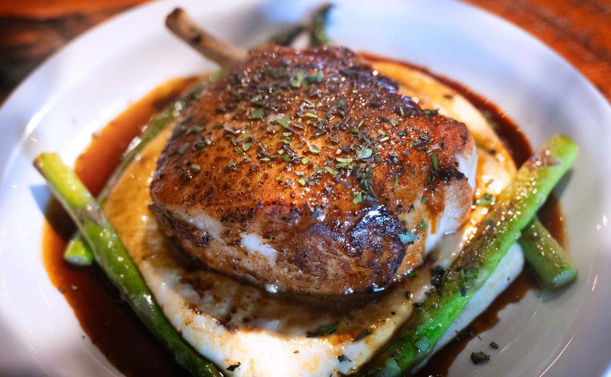 The double-cut Duroc pork chop started as a special that now chef Keno can’t take off the menu.