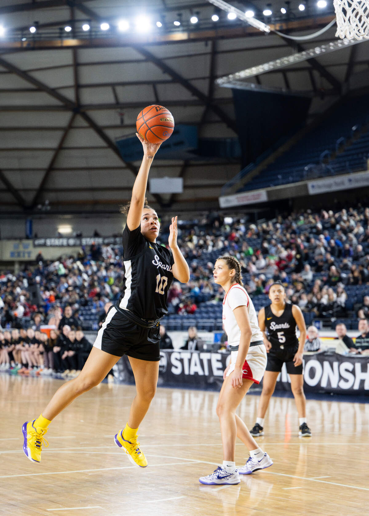 Sumner’s Olivia Collins (10) shots the ball and is fouled by the Camas Papermakers during the semifinals game of the Class 4A state tournament at the Tacoma Dome, on Friday, March 1, 2024, in Tacoma, Wash.
